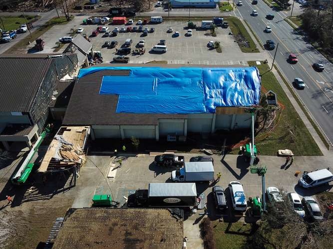 Aerial view of ongoing roof repair in Dallas, TX