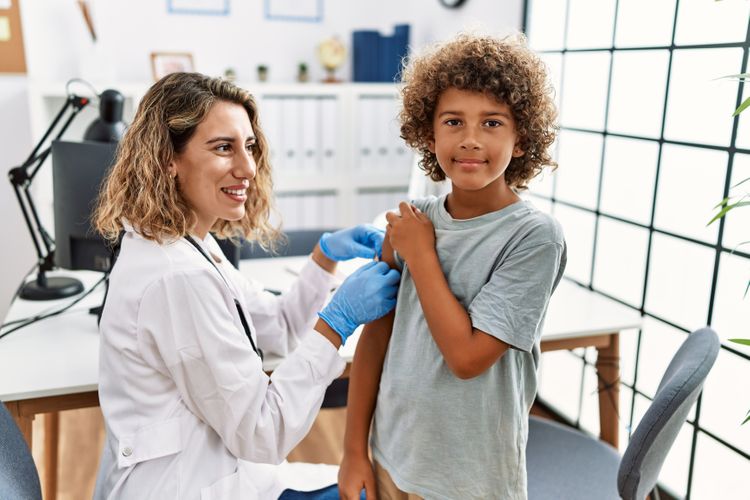 Child receiving a vaccine Immunizations