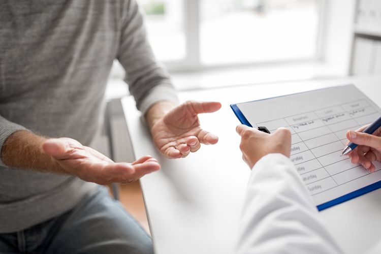 Man discussing health situation with a doctor Erectile Dysfunction