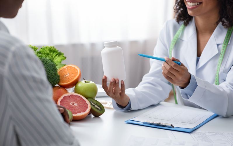 Pharmacist Discussing Vitamins & Supplements Vitamins & Supplements