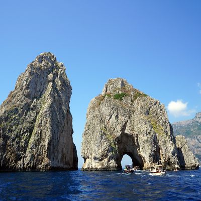 Boating through the Faraglioni Rocks