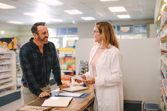 Pharmacist and patient talking Medication Therapy Management