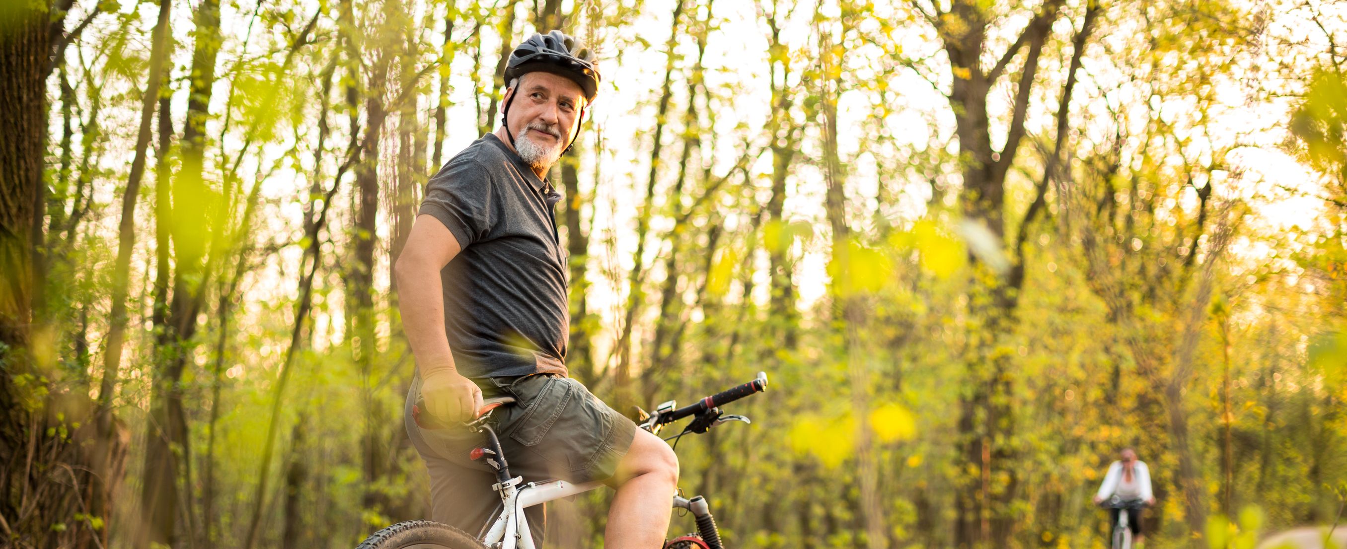 Elderly man on a bike in the woods Erectile Dysfunction