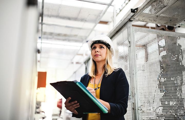 a-portrait-of-an-industrial-woman-engineer-in-a-fa-CYESUW4.jpg