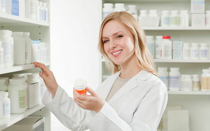 Pharmacist checking medication