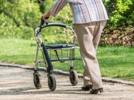 Woman with walker in the park Woman with walker in the park