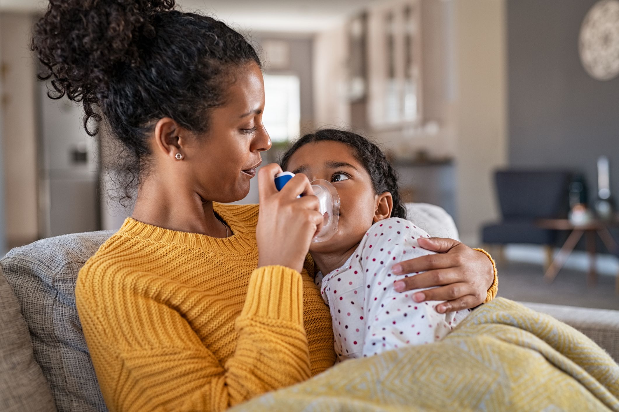 Image of a mother giving medication to her child Medication Adherence