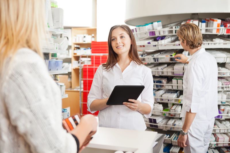 Pharmacists with patient