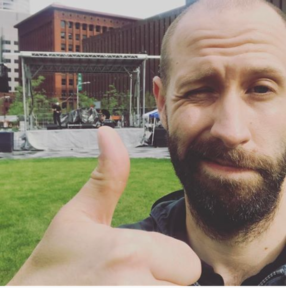 An image of Joel Dodson doing a thumbs up at a St. Louis concert