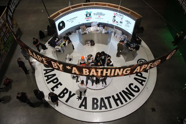 A curved LED wall display at AAPE's booth at ComplexCon