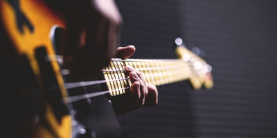 A man playing a bass guitar