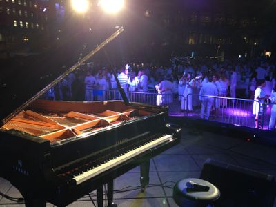 An image of a Yamaha piano on a stage