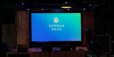 Projection screen with German Haus logo at SXSW