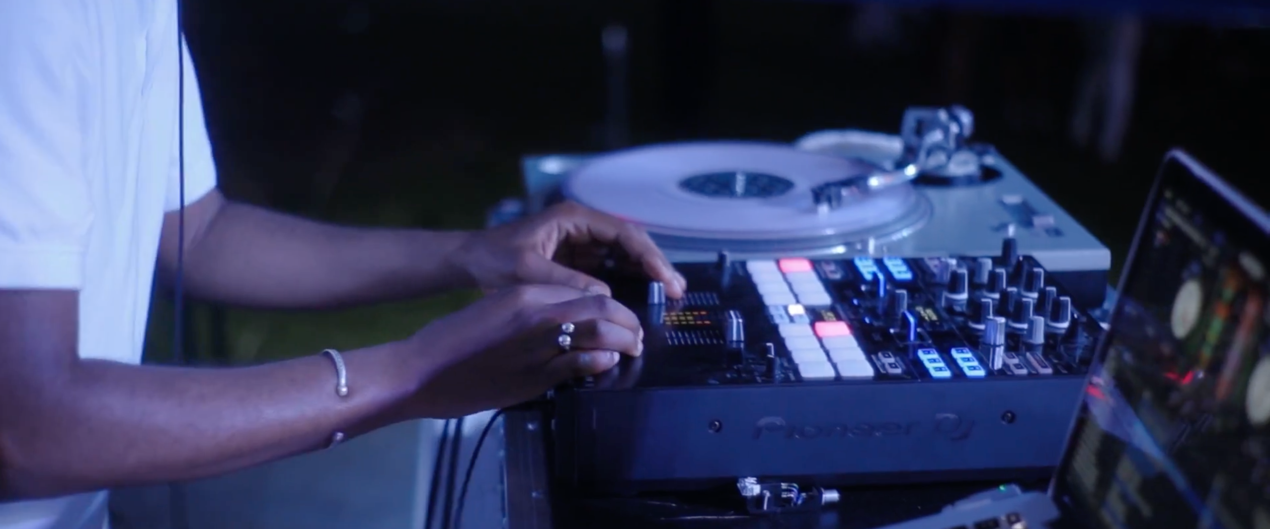 A DJ spinning at a party