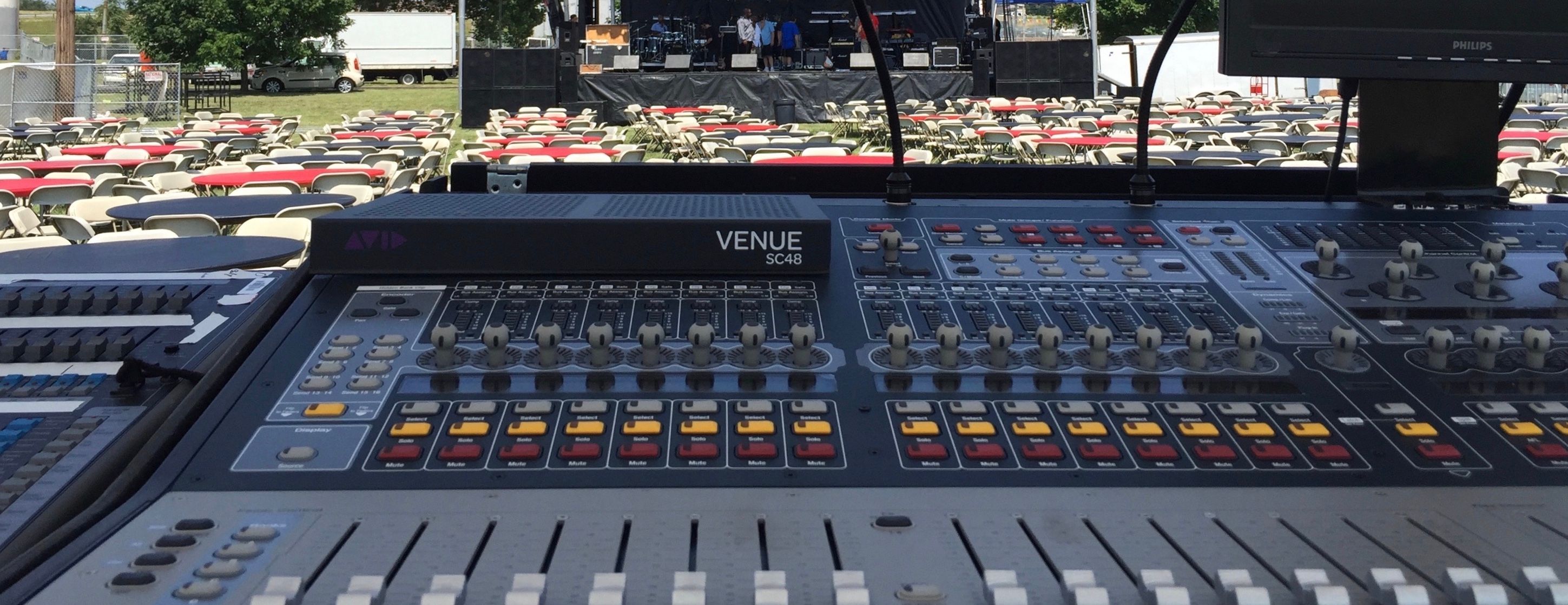 An audio mixer at an outdoor concert