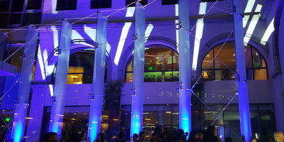 Moving lighting shining on the outside of a hotel