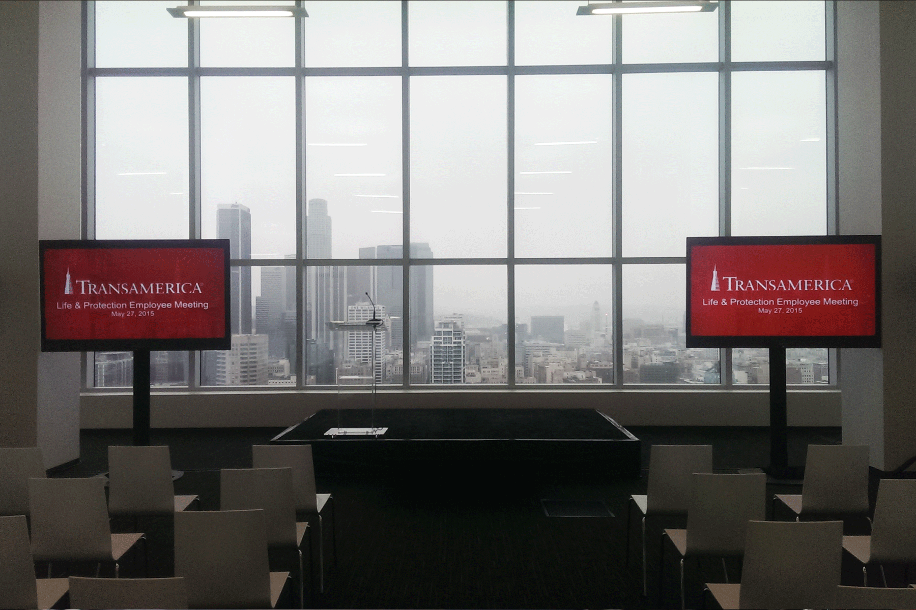 Two LED TV's displayed at a meeting