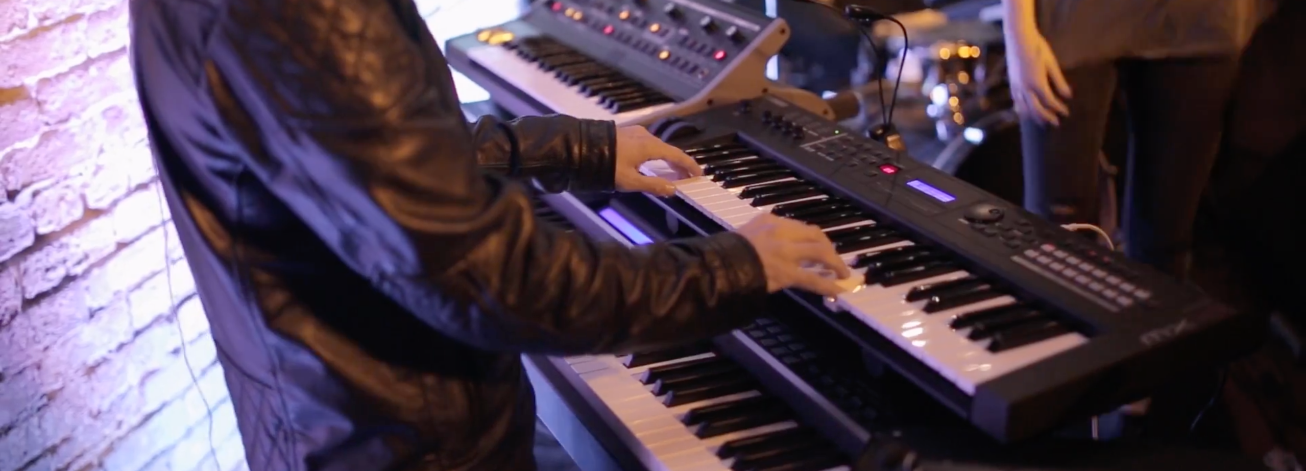 A man playing the keyboard at a party