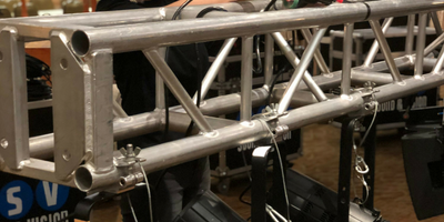 Image of lights rigged to a truss at a corporate conference