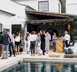 An image of an outdoor holiday party in Austin, Texas with string lighting provided by TSV