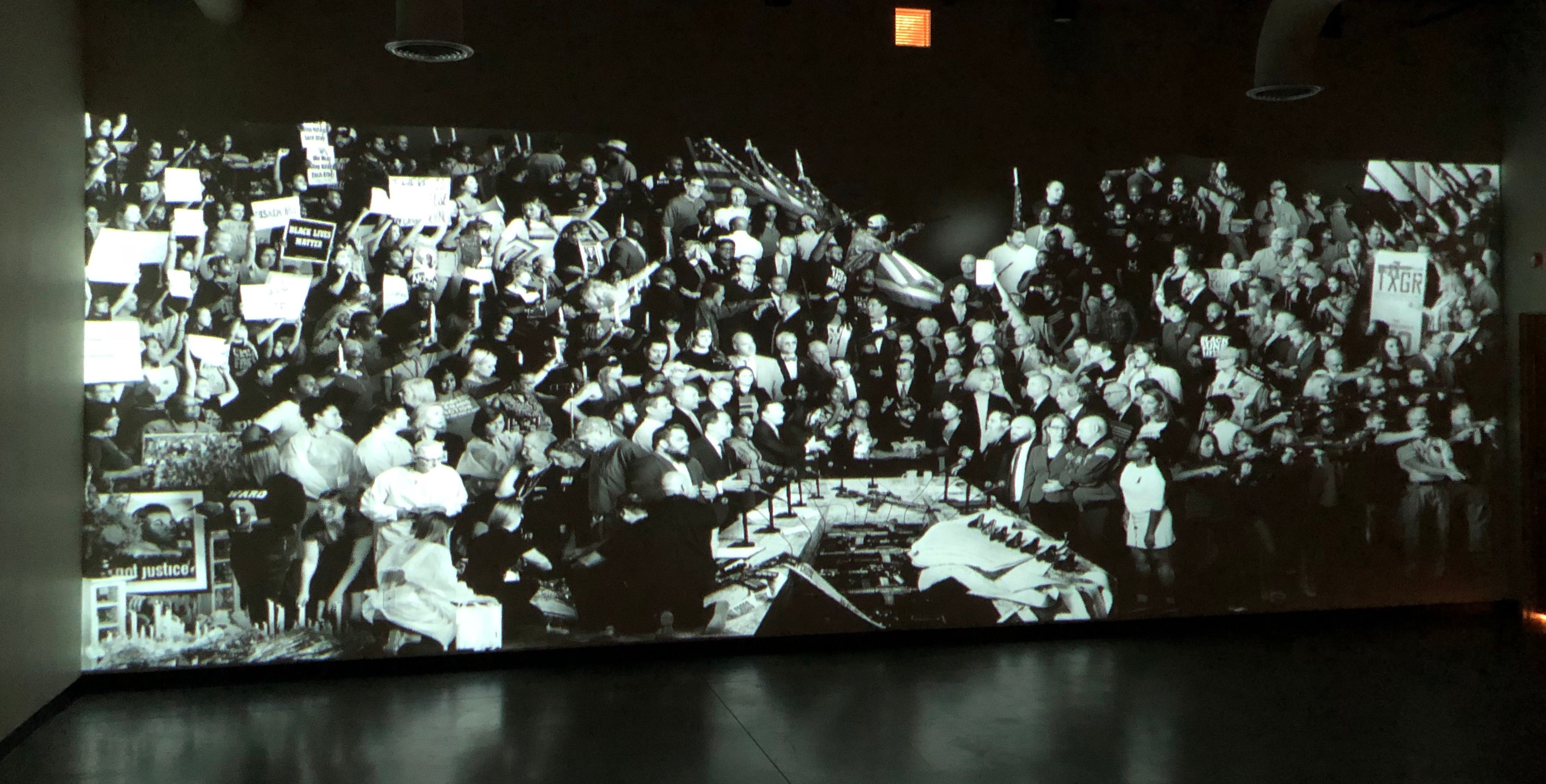 A large projection screen at a St. Louis event