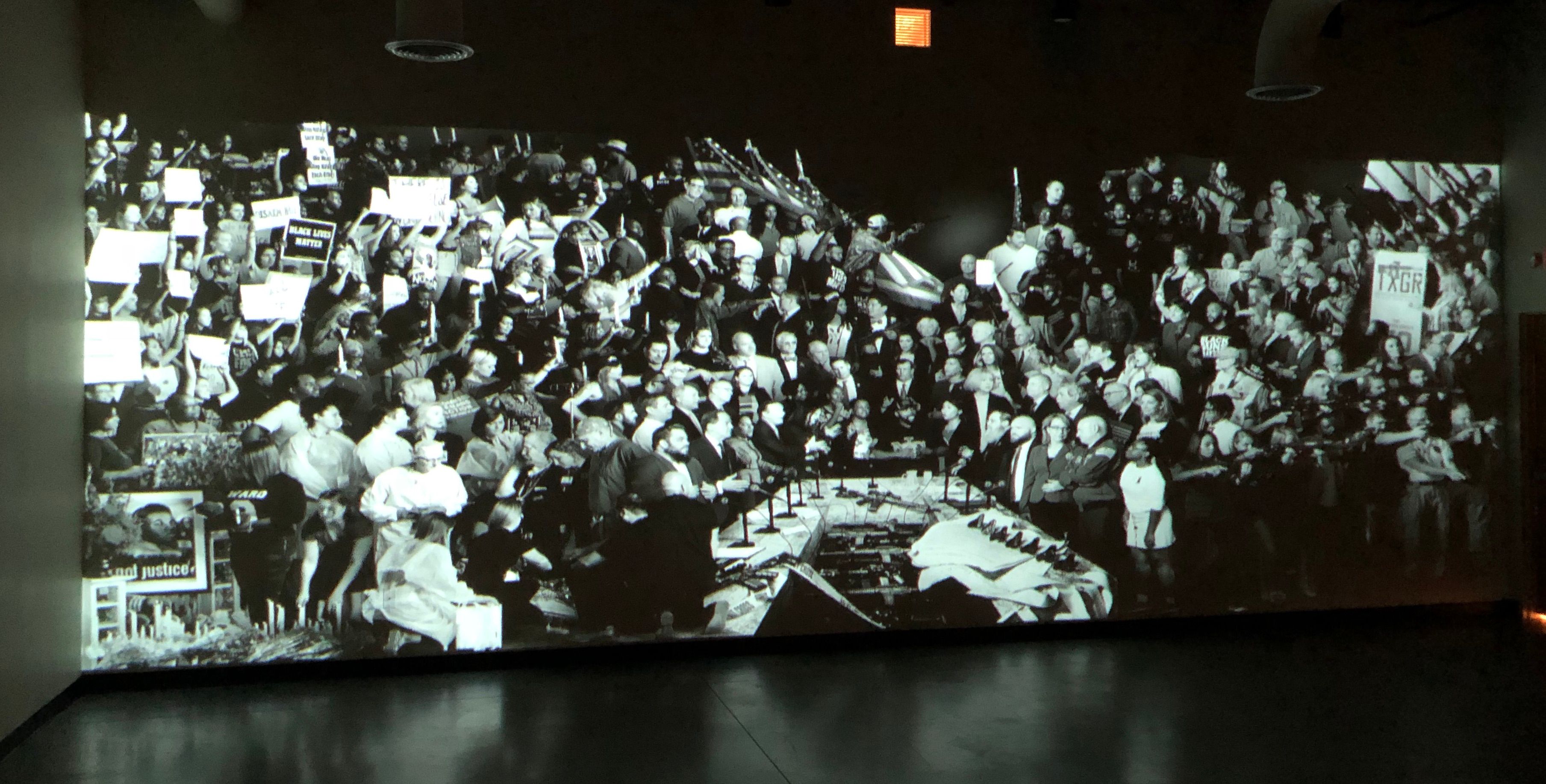 A large projection screen at a St. Louis event