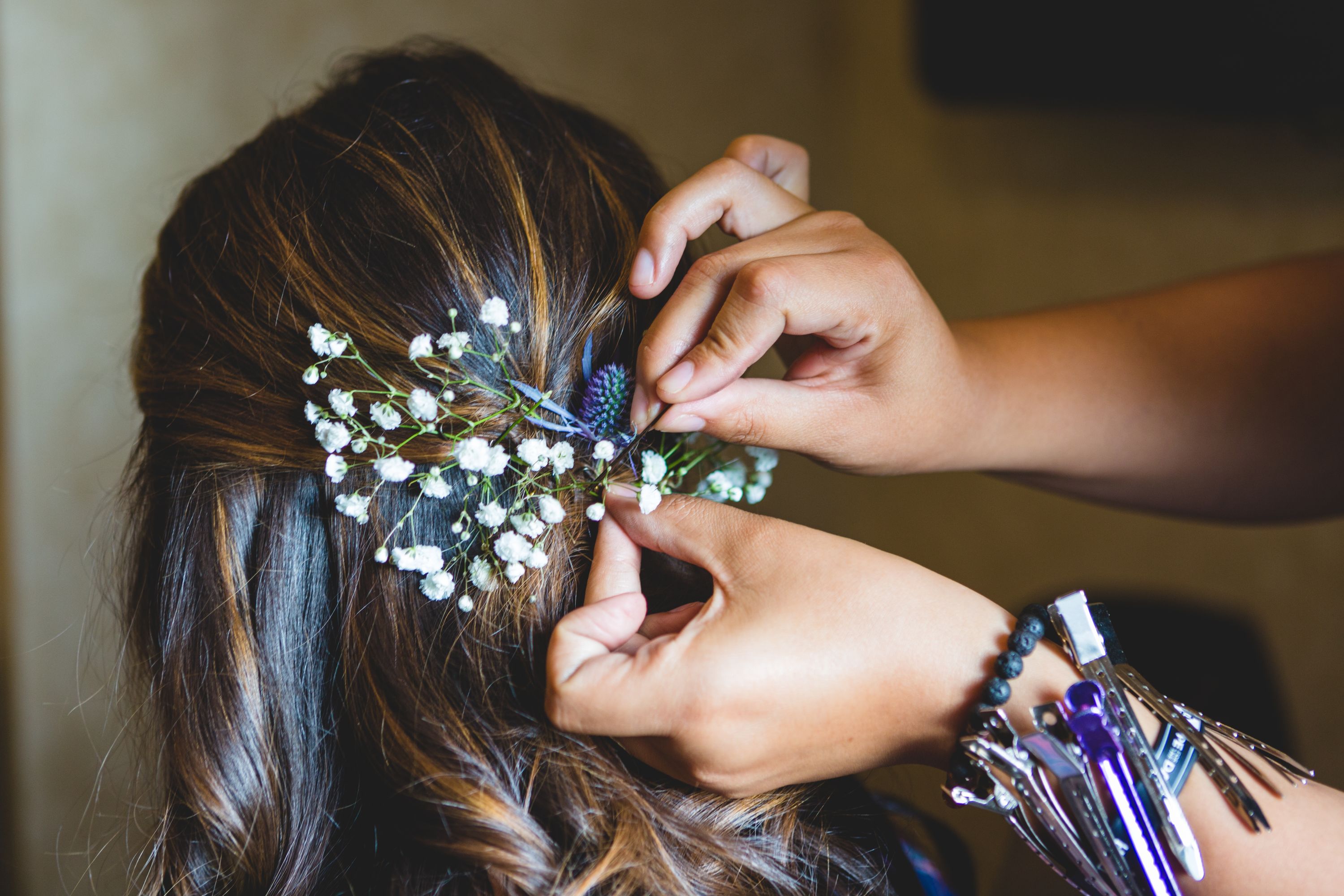 pinning-flowers-in-hair-QJ7F8SK.jpg