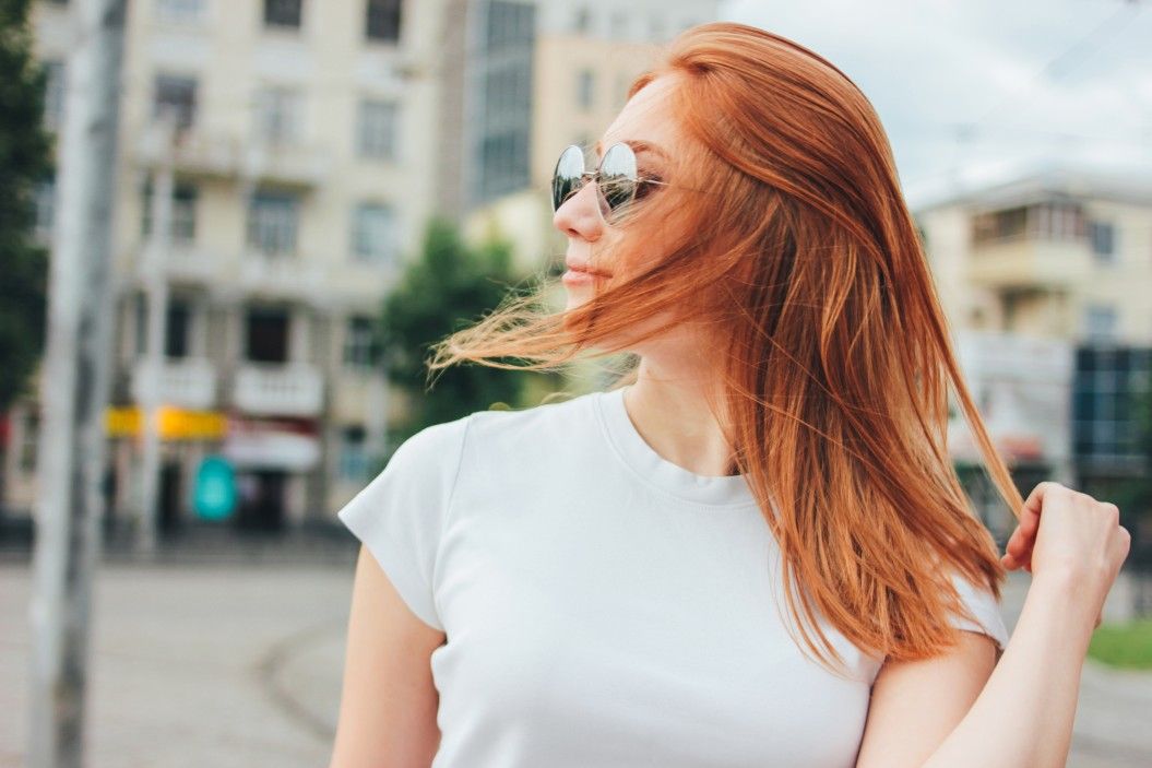 close-up-portrait-of-attractive-redhead-smiling-girl-in-sunglasses-in-casual-clothes-at-street-in-the_t20_0xLJ7k.jpg