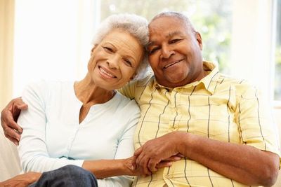 An elderly couple embraces Long Term Care