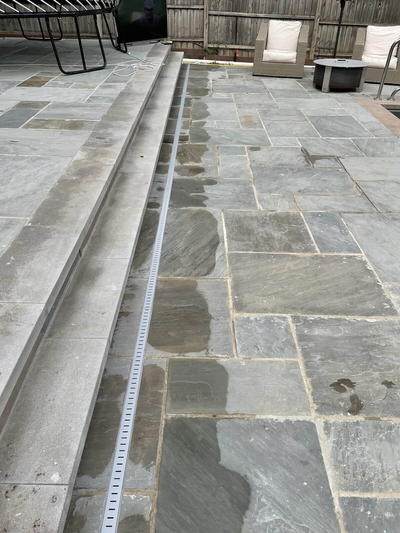 Installation Of Linear Drain System On Bluestone Patio