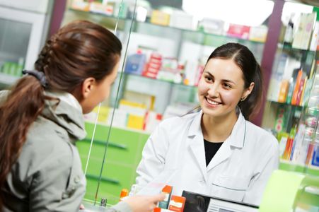 Pharmacist and patient having a consultation at pharmacy 