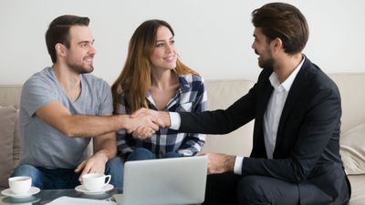 landlord shaking hands with tenants