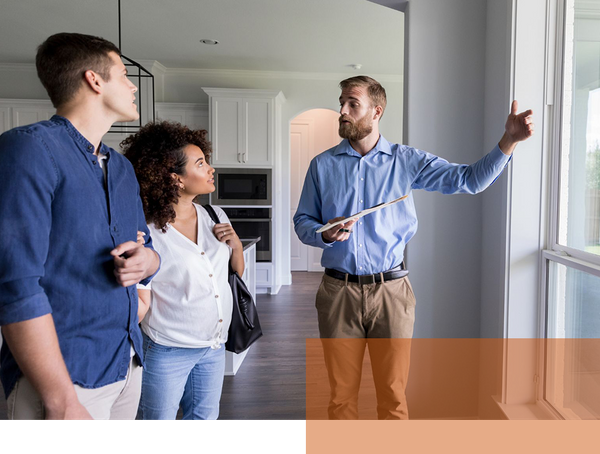 Real estate agent showing house to future tenants