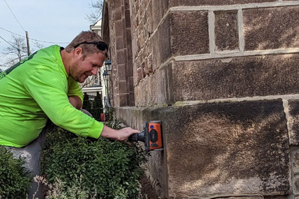GPRS Area Manager Sam Hart inspects the cornerstone of Saint Paul’s Episcopal Church with a StructureScanTM Mini XT handheld GPR system