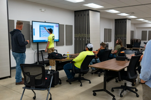 GPRS Trainer Matt Vaillant looks on as trainees learn to identify subtle differences in GPR signal outputs.