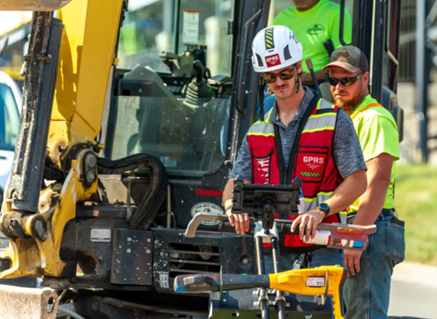 A GPRS Project Manager utilizes a large GPR unit to scan for subsurface utilities prior to excavation.