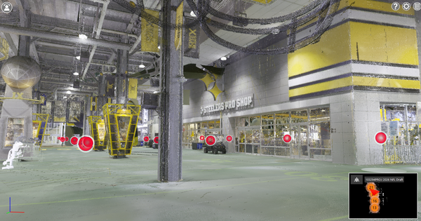 A still image of a 3D photogrammetry walkthrough tour of part of the interior space at Acrisure Stadium. Red bubbles denote scanning locations and can be clicked on to navigate through the images. The walls are grey, with black, white, and yellow decorations. The Steelers Pro Shop is shown on the right. The lower right shows a legend of where in the walkthrough tour this image appears. High-definition 3D photogrammetry images can be stitched together to create an accurate walkthrough tour to help designers, event staff, and engineers plan their work without needing to be on-site.