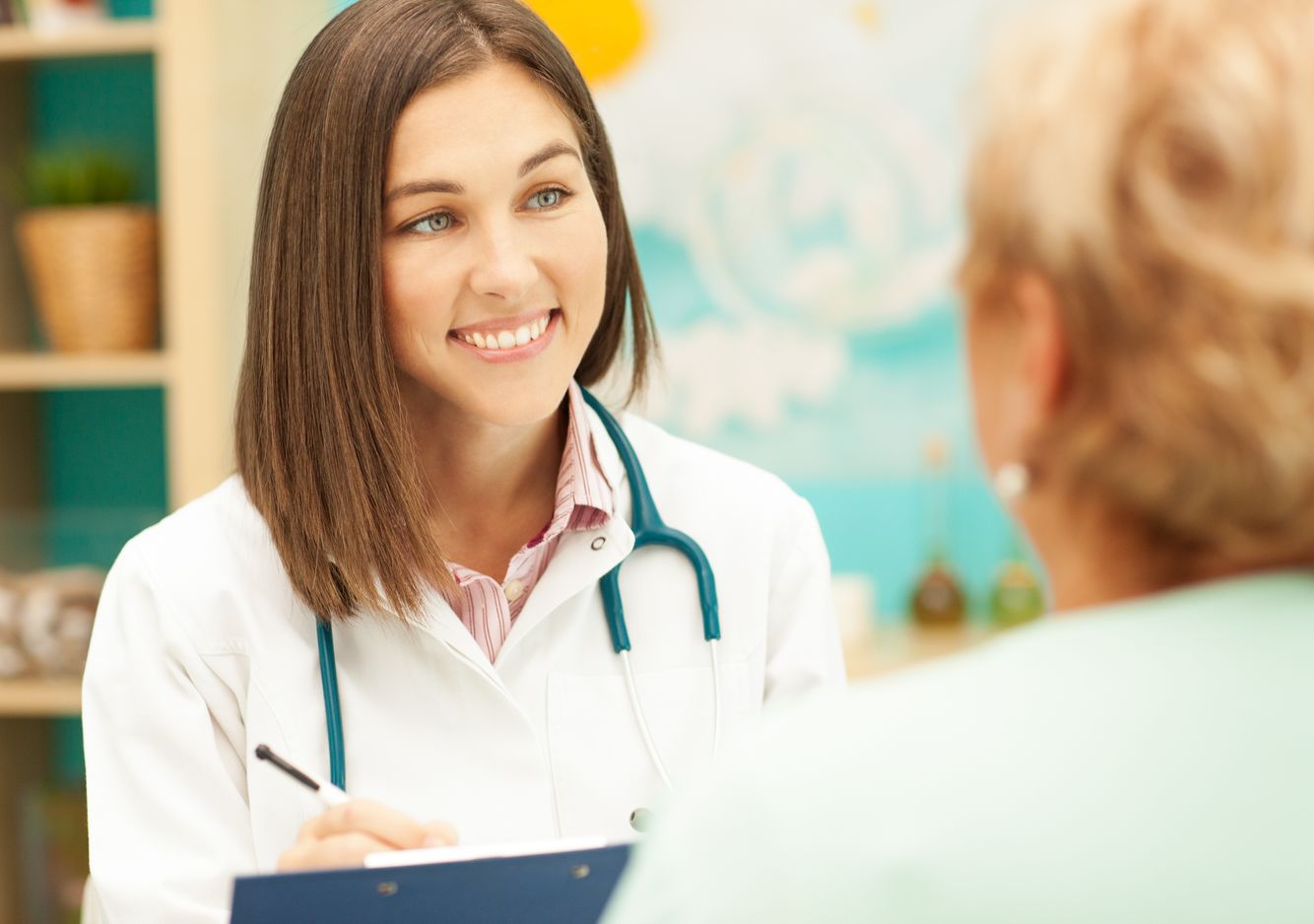 Image of a pharmacist smiling to an elderly customer Pharmacy Services