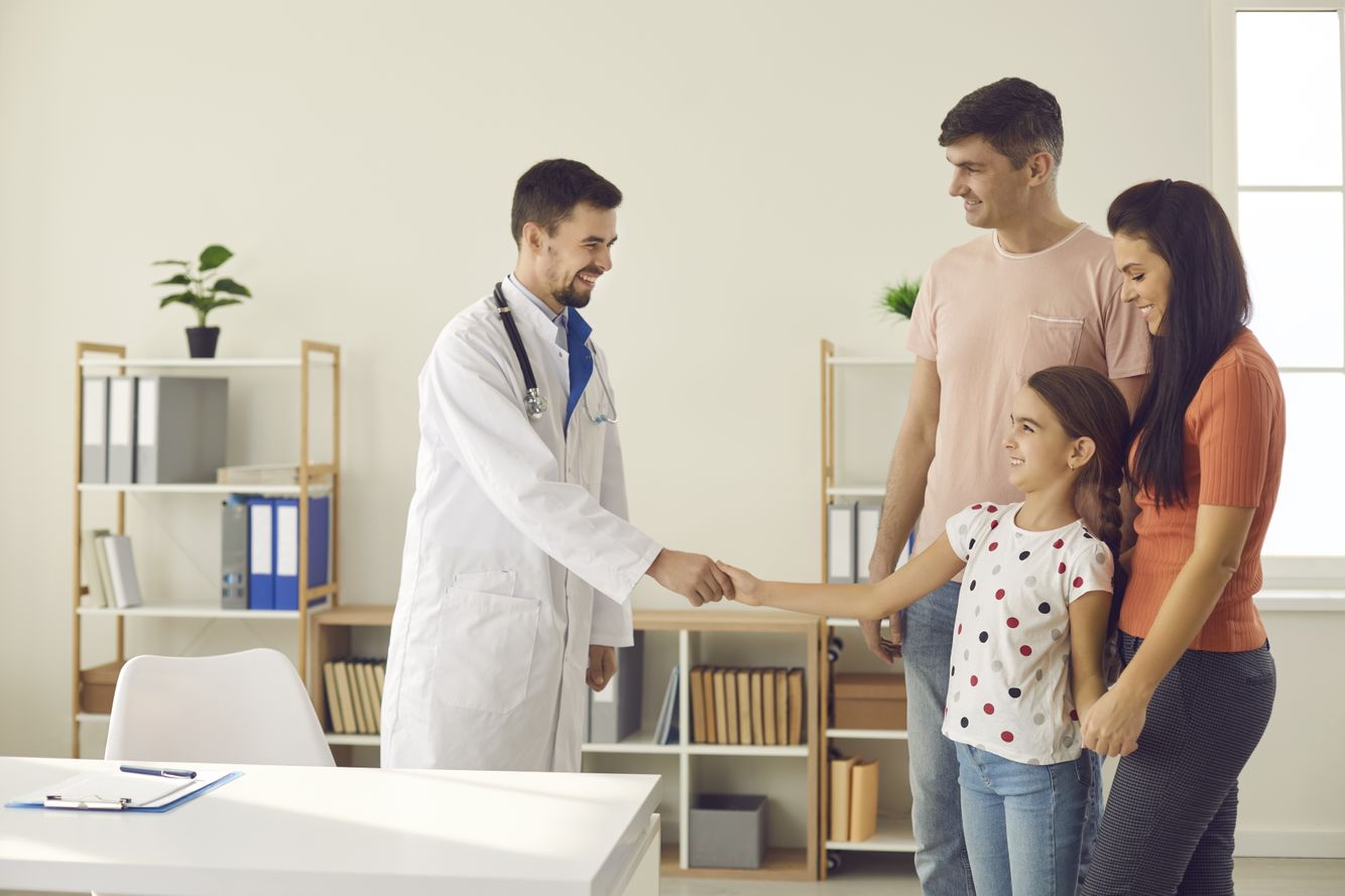 Image of a family shaking hands with a healthcare professional Medication Therapy Management