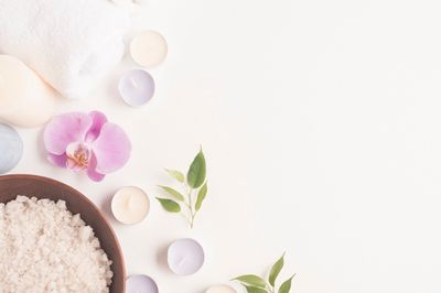 bath-salt-with-orchid-flower-candles-white-backdrop_23-2147867845.jpg