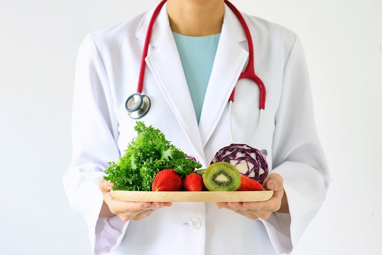 Pharmacist with fruits and vegetables Nutrient Depletion Counseling
