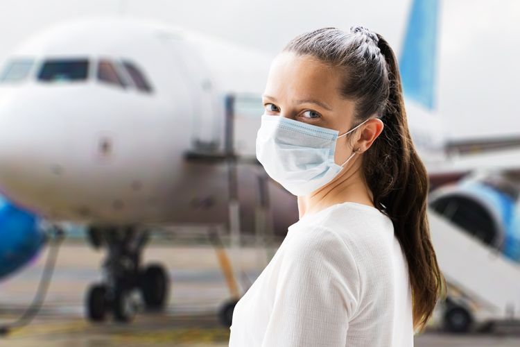 Woman and an airplane Travel Vaccinations