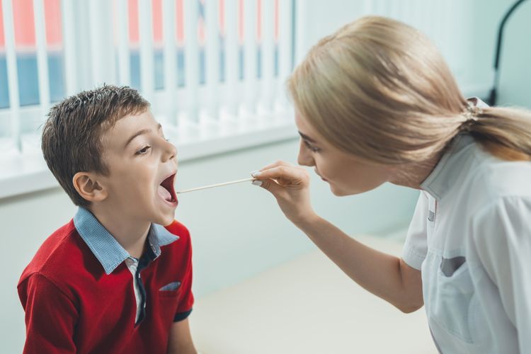 Child receiving a strep throat test Wellness Screenings