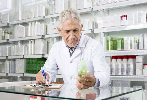 Pharmacist Reading Medication Label