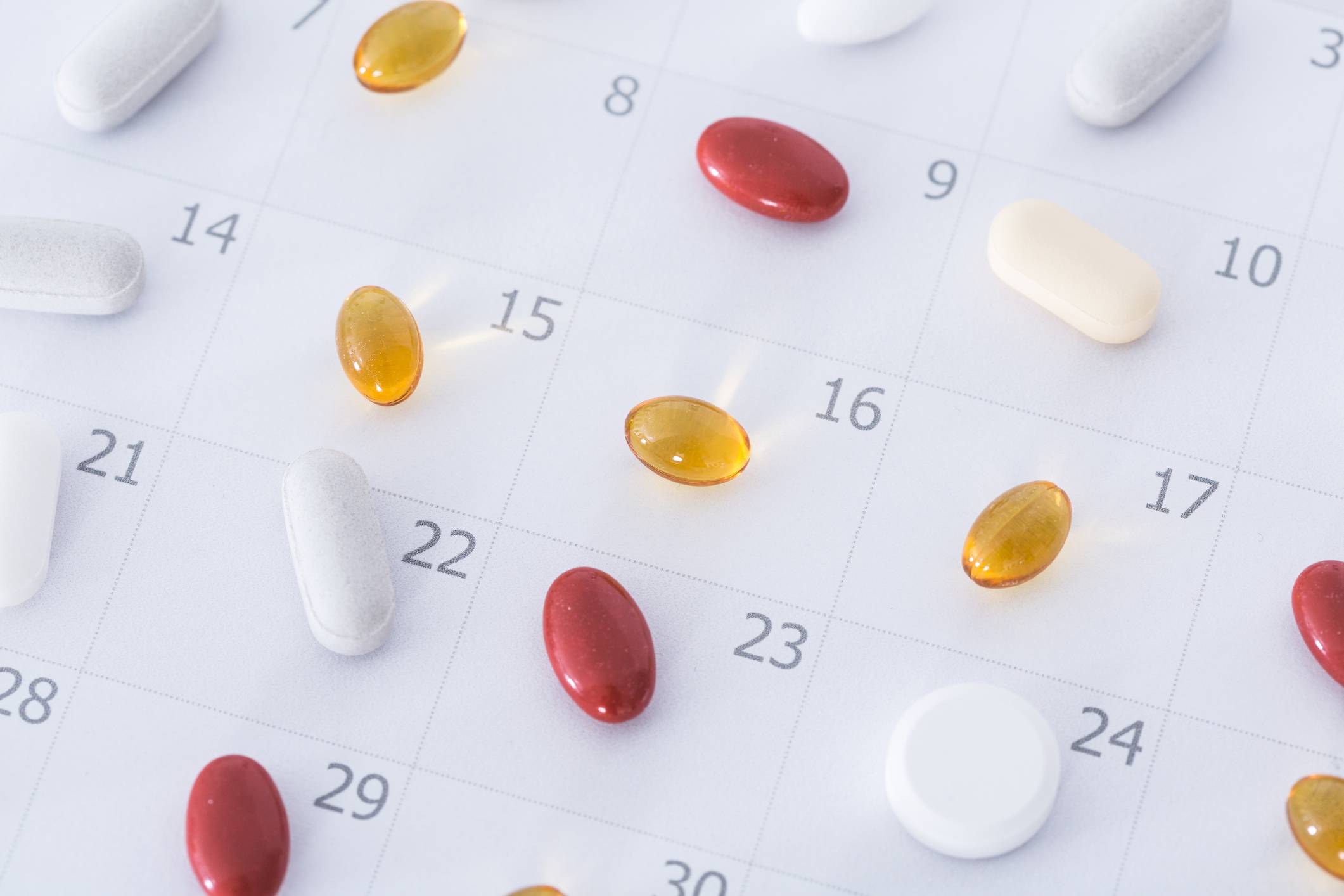 Pills on a calendar Medication Synchronization