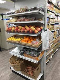Shelves of fruits and vegetables Locally-Owned Natural Store