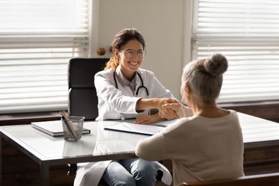 Pharmacist with patient