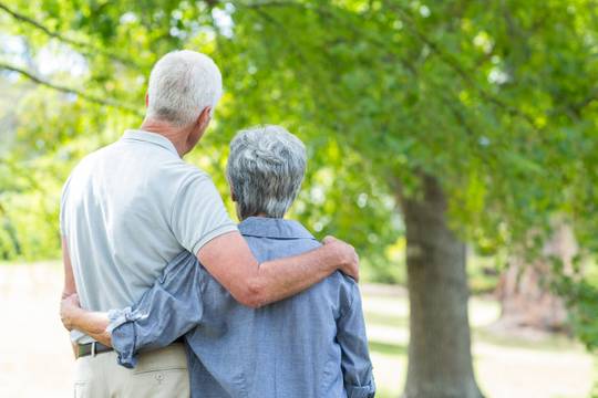 Couple turned away holding each other