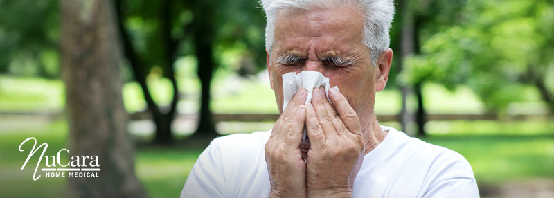 Man blowing his nose Sleep Apnea & Allergies