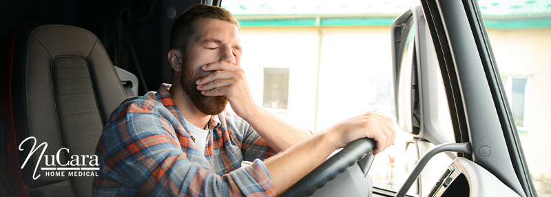 Man who is yawning in a car CPAP Therapy